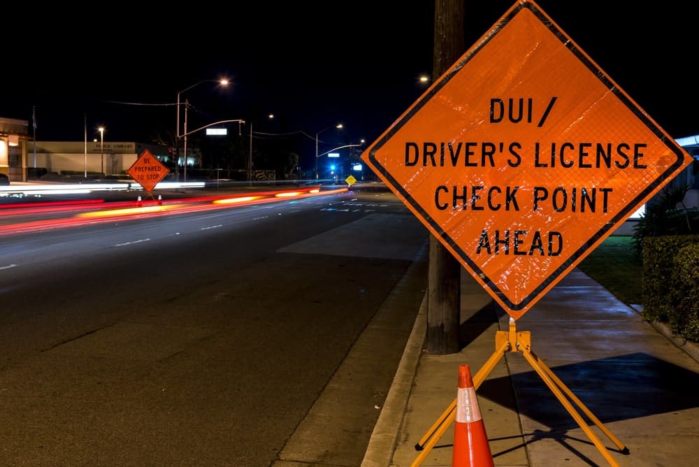 DUI checkpoint sign showing enforcement of license rules for college students in Florida.