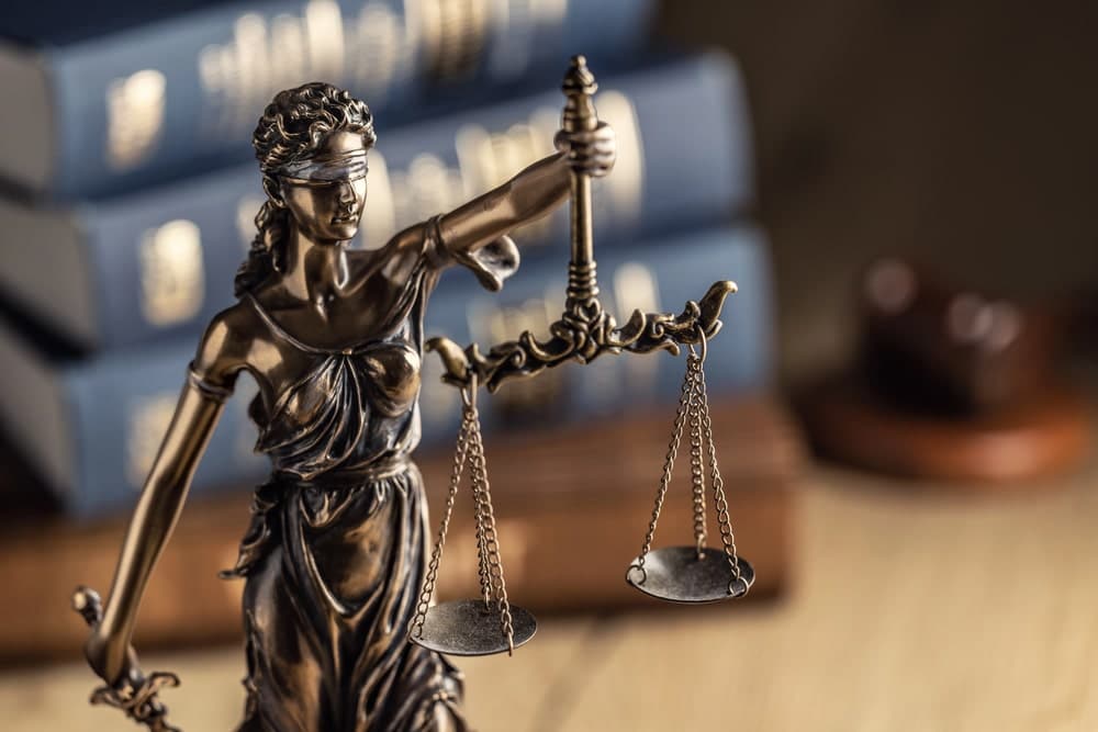 Image is of a Lady Justice statue holding balanced scales, concept of fairness and due process in Florida DUI cases.