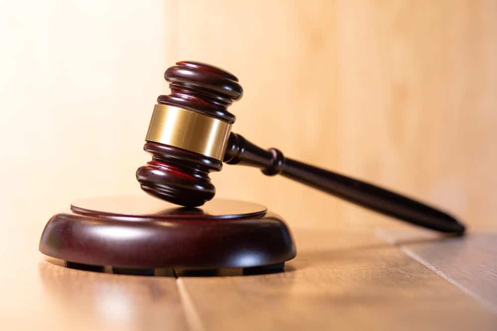 Image is of a judge’s gavel resting on a sound block, representing a court decision that authorizes expungement in Florida.