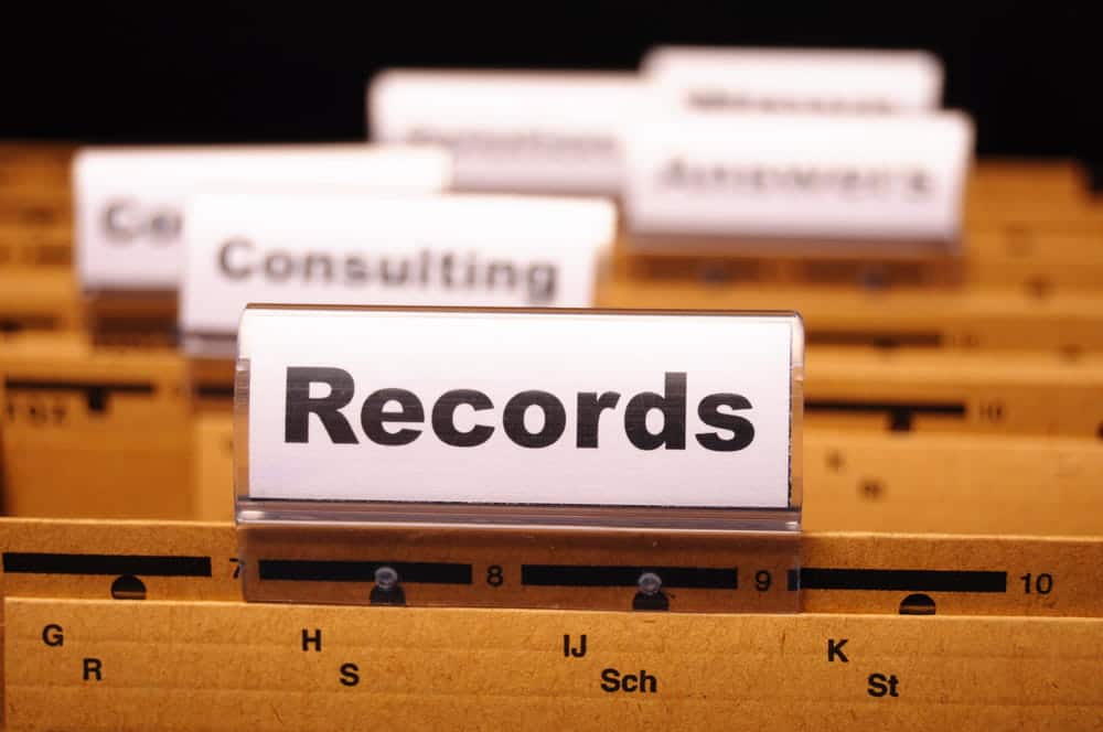 Image is of organized file folders labeled records, symbolizing record control and cleanup through administrative expungement