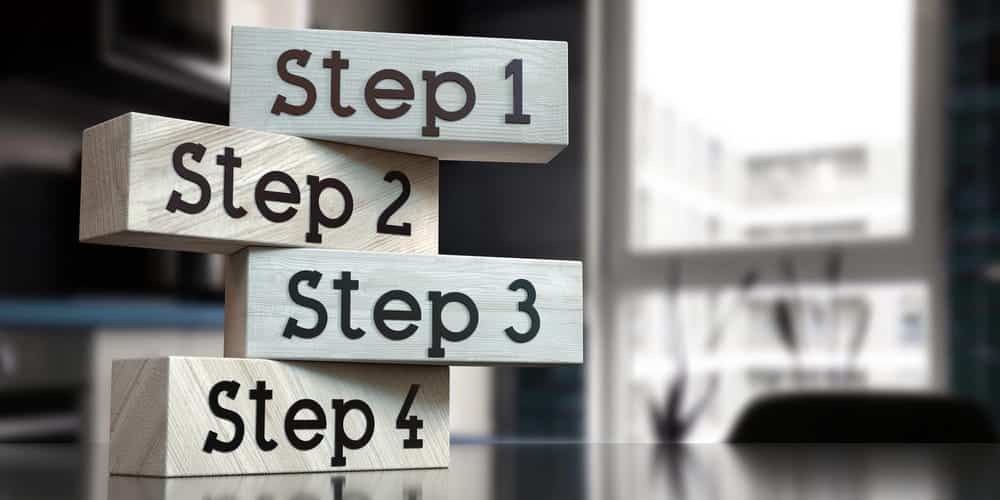 Image is of stacked step blocks illustrating the structured legal process involved in court-ordered expungement