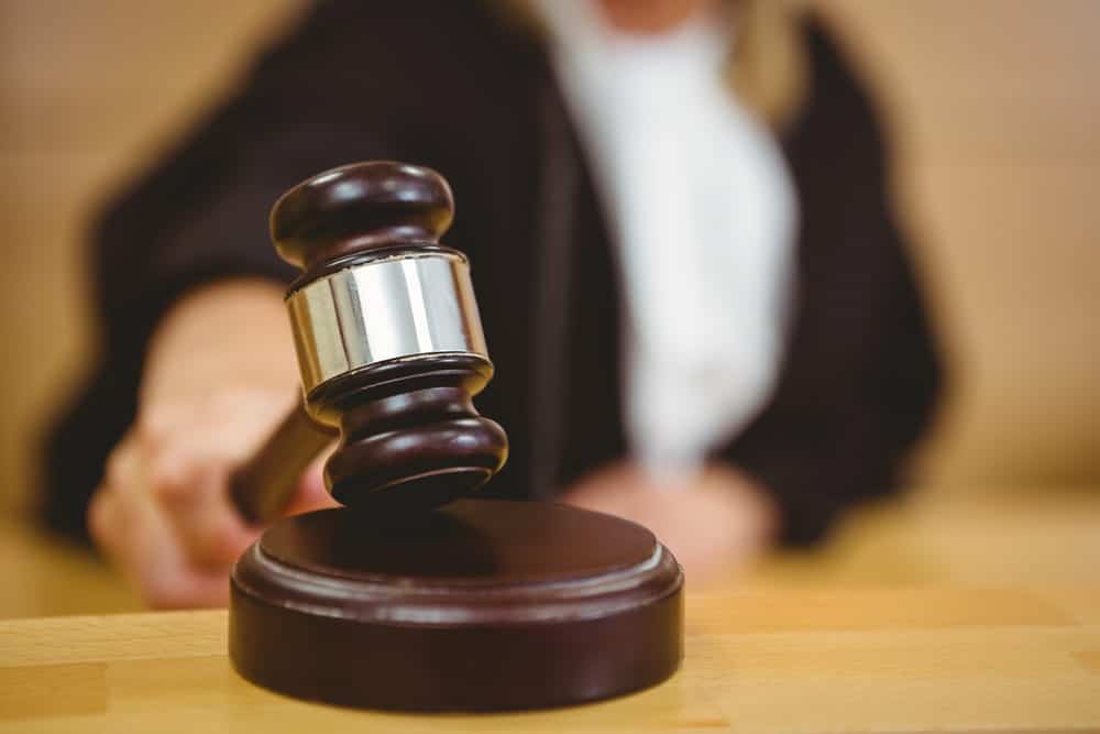 Image is of a judge’s gavel in a courtroom setting, representing legal decisions related to expungement options